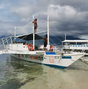 Guests aboard an outrigger banca boat at Bangcogon